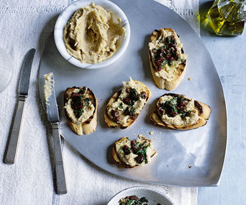 White bean puree canape with chopped herbs