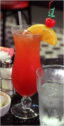 New Orleans Hurricane with an orange slice and cherry on a cocktail skewer New Orleans Hurricane with an orange slice and cherry on a cocktail skewer